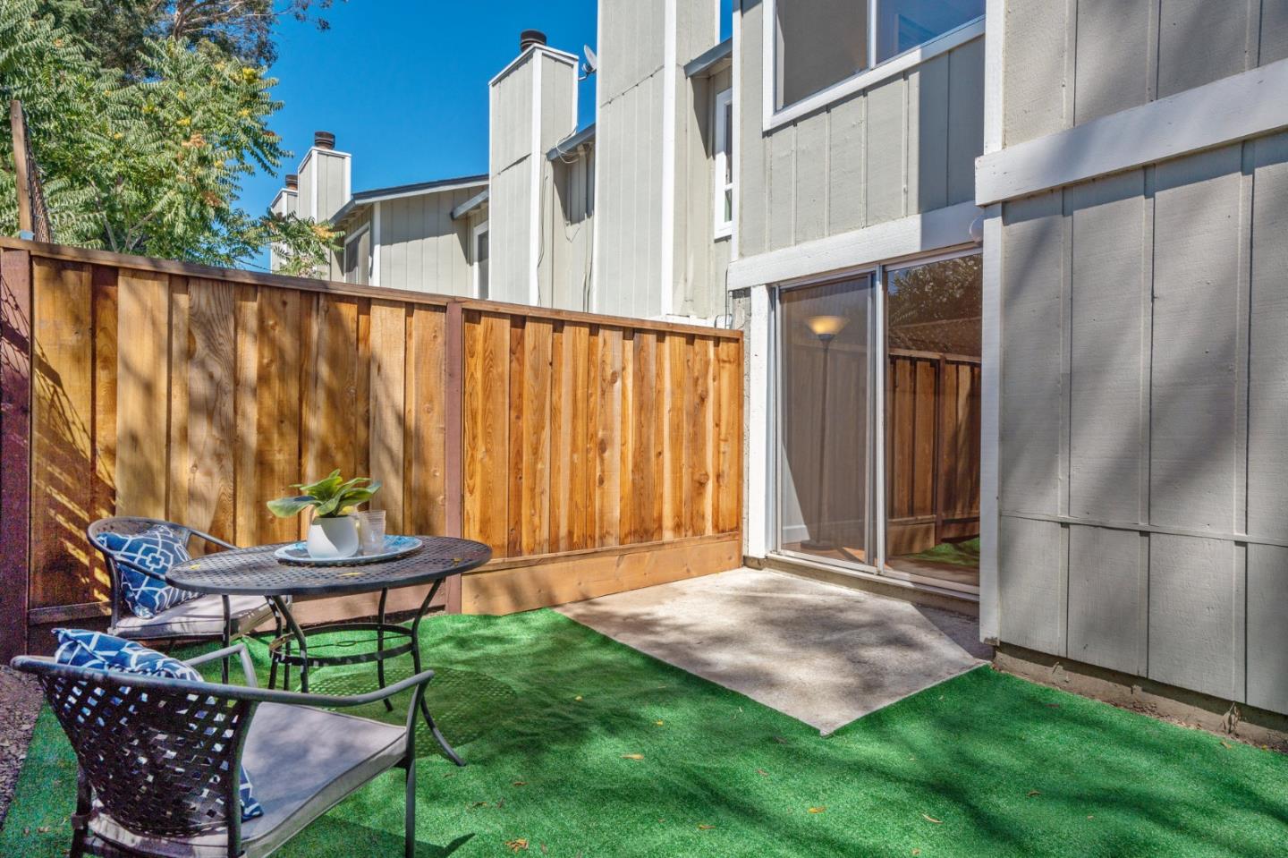 101 Redding Road, Unit B2 Campbell, CA 95008 - Photo 10 of 32 a backyard of a house with table and chairs
