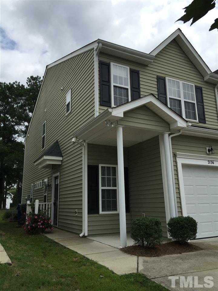 2136 Persimmon Ridge Drive Raleigh, NC 27604 - Photo 2 of 23 a front view of a house with a garden