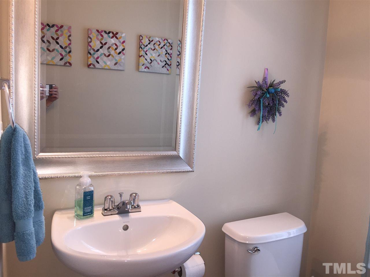 2136 Persimmon Ridge Drive Raleigh, NC 27604 - Photo 12 of 23 a bathroom with a toilet and a sink