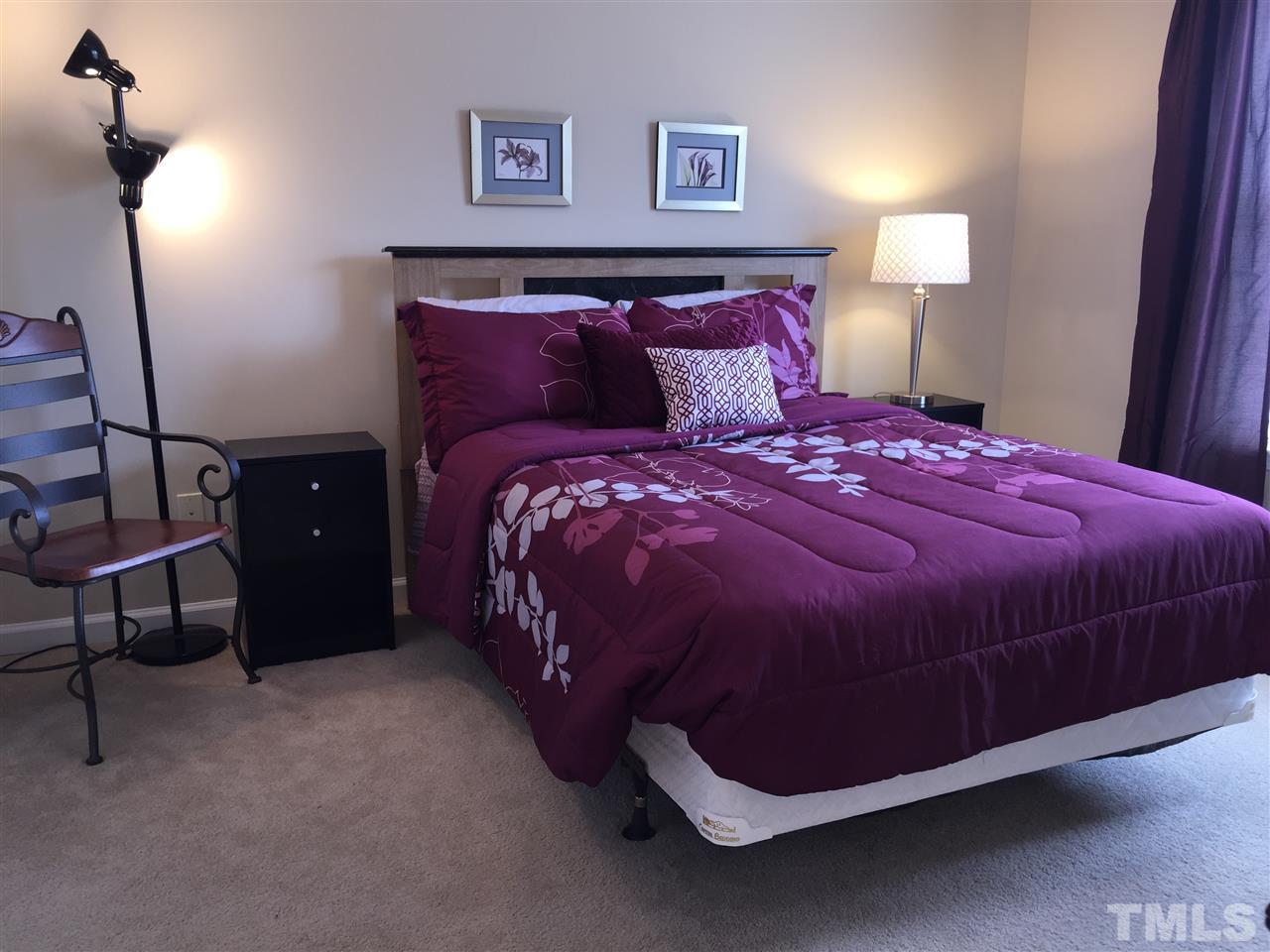 2136 Persimmon Ridge Drive Raleigh, NC 27604 - Photo 17 of 23 a bedroom with a bed and a window