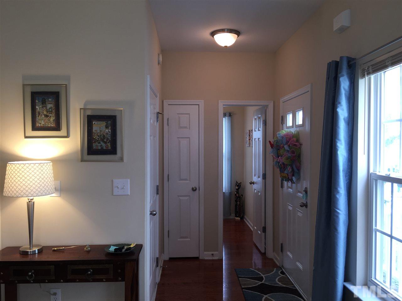 2136 Persimmon Ridge Drive Raleigh, NC 27604 - Photo 3 of 23 a view of a bathroom with a sink mirror and a window