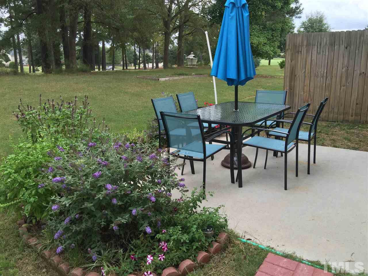 2136 Persimmon Ridge Drive Raleigh, NC 27604 - Photo 21 of 23 a view of a chairs and table in the patio