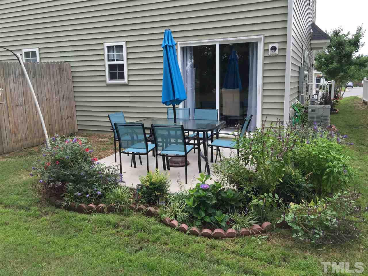 2136 Persimmon Ridge Drive Raleigh, NC 27604 - Photo 22 of 23 a couple of table and chairs in the yard