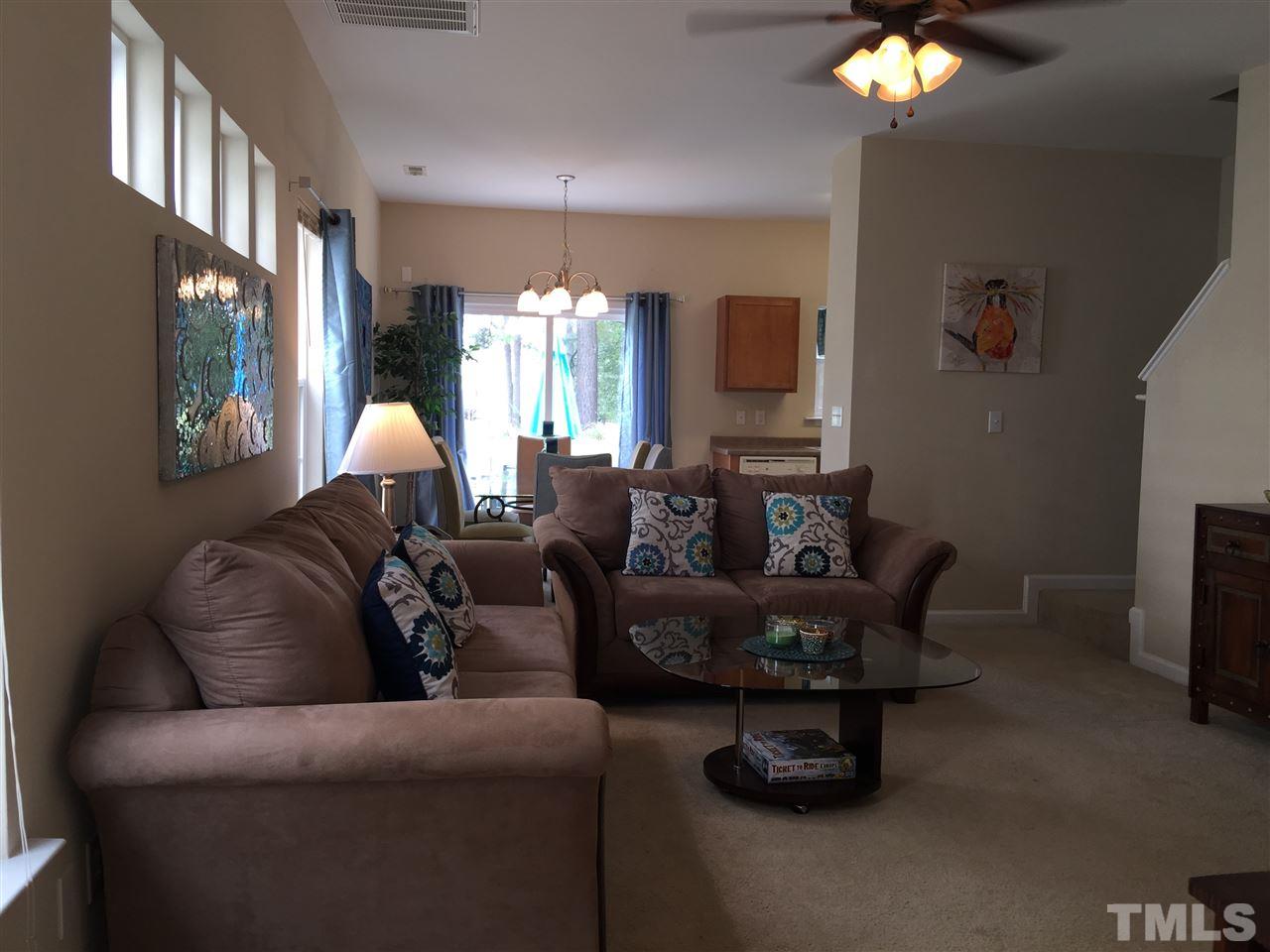 2136 Persimmon Ridge Drive Raleigh, NC 27604 - Photo 4 of 23 a living room with furniture and a chandelier