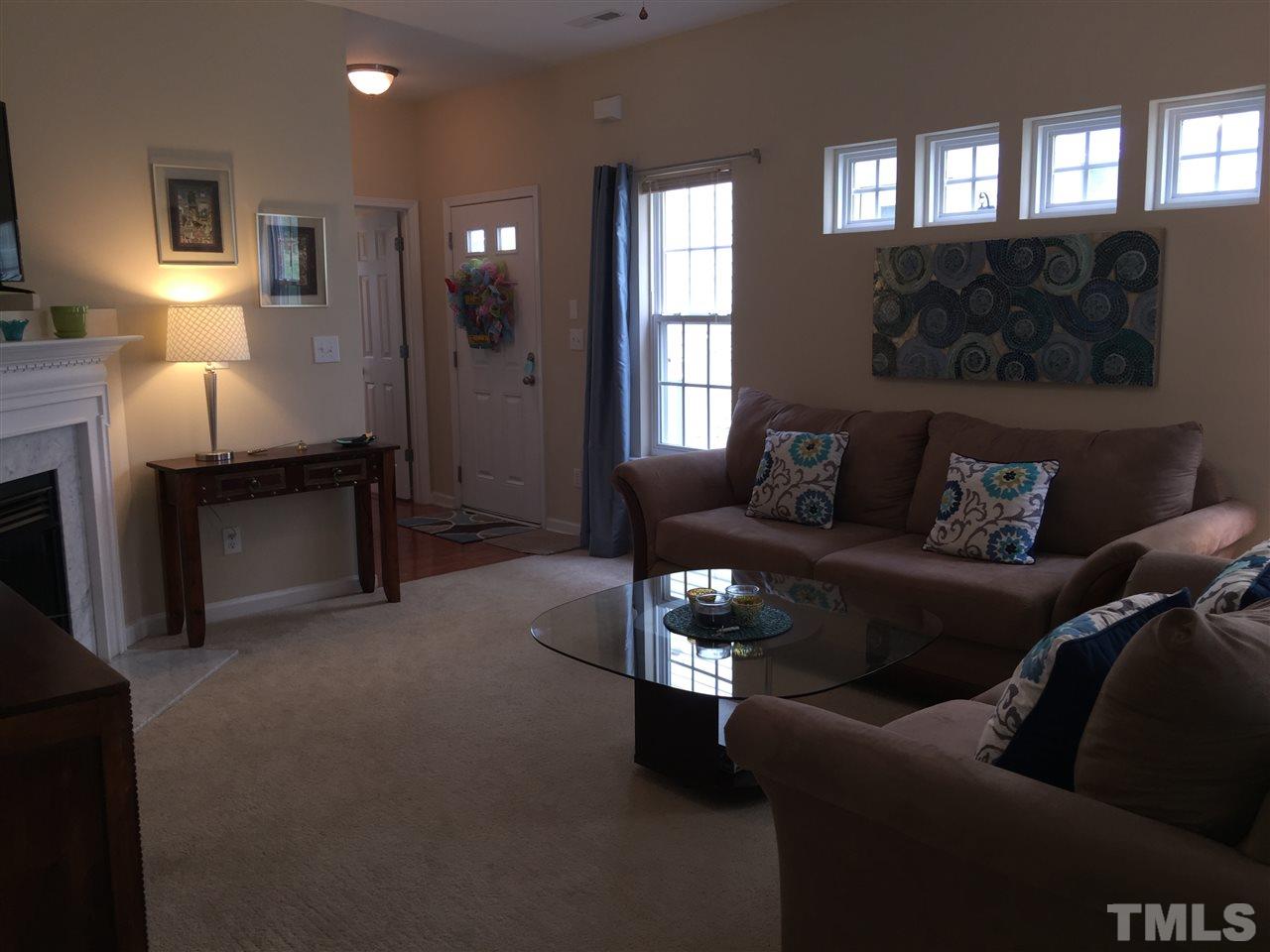 2136 Persimmon Ridge Drive Raleigh, NC 27604 - Photo 6 of 23 a living room with furniture and a fireplace