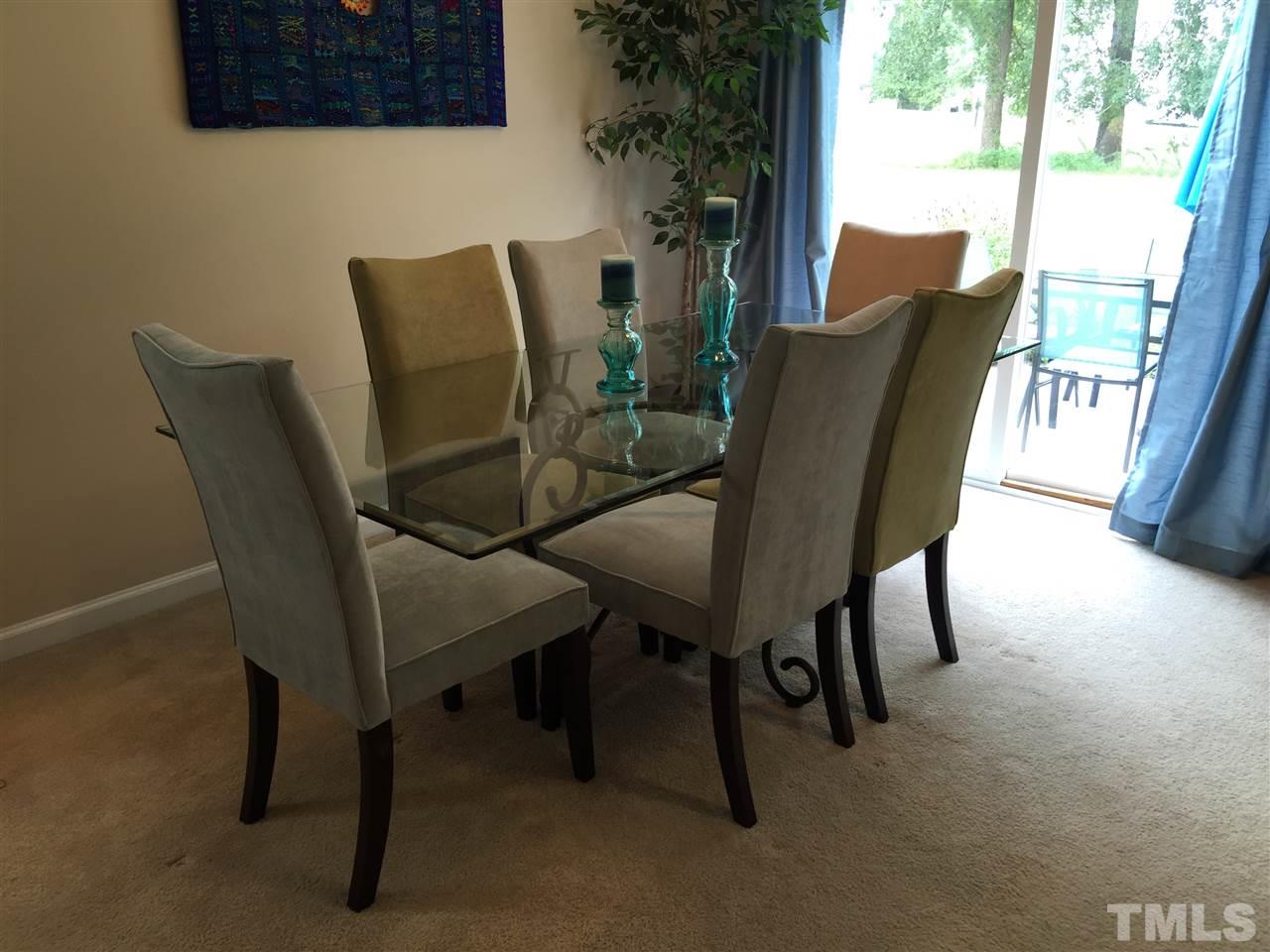 2136 Persimmon Ridge Drive Raleigh, NC 27604 - Photo 8 of 23 a view of a dining room with furniture and wooden floor