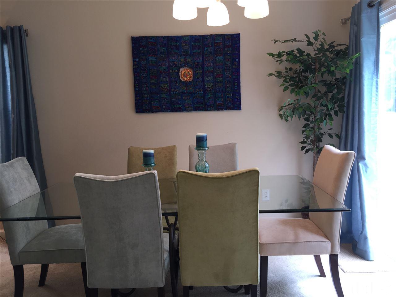 2136 Persimmon Ridge Drive Raleigh, NC 27604 - Photo 9 of 23 a living room with furniture and a potted plant
