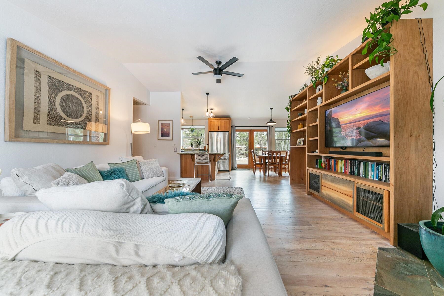 11151 Dorchester Drive Truckee, CA 96161 - Photo 12 of 27 a living room with furniture and a book shelf