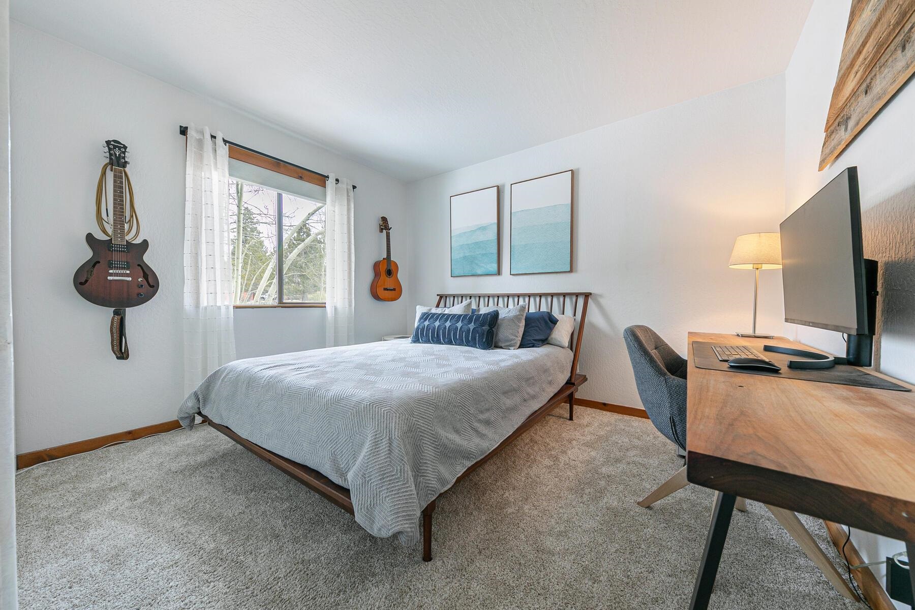 11151 Dorchester Drive Truckee, CA 96161 - Photo 16 of 27 a bedroom with a bed window and flat screen tv