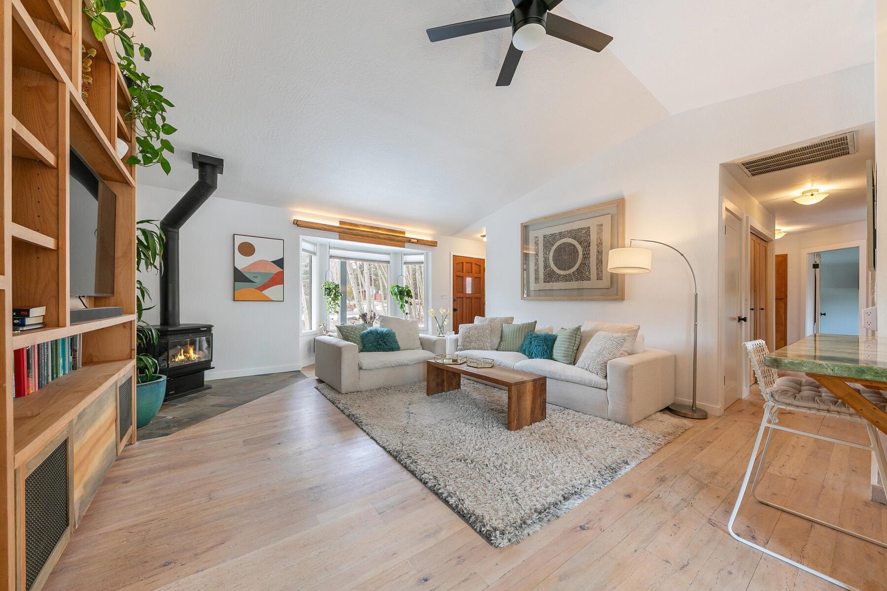 11151 Dorchester Drive Truckee, CA 96161 - Photo 2 of 27 a living room with furniture and a flat screen tv