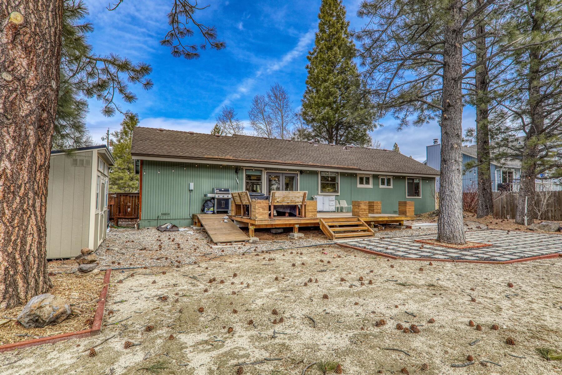 11151 Dorchester Drive Truckee, CA 96161 - Photo 23 of 27 a view of a house with a patio and wooden fence