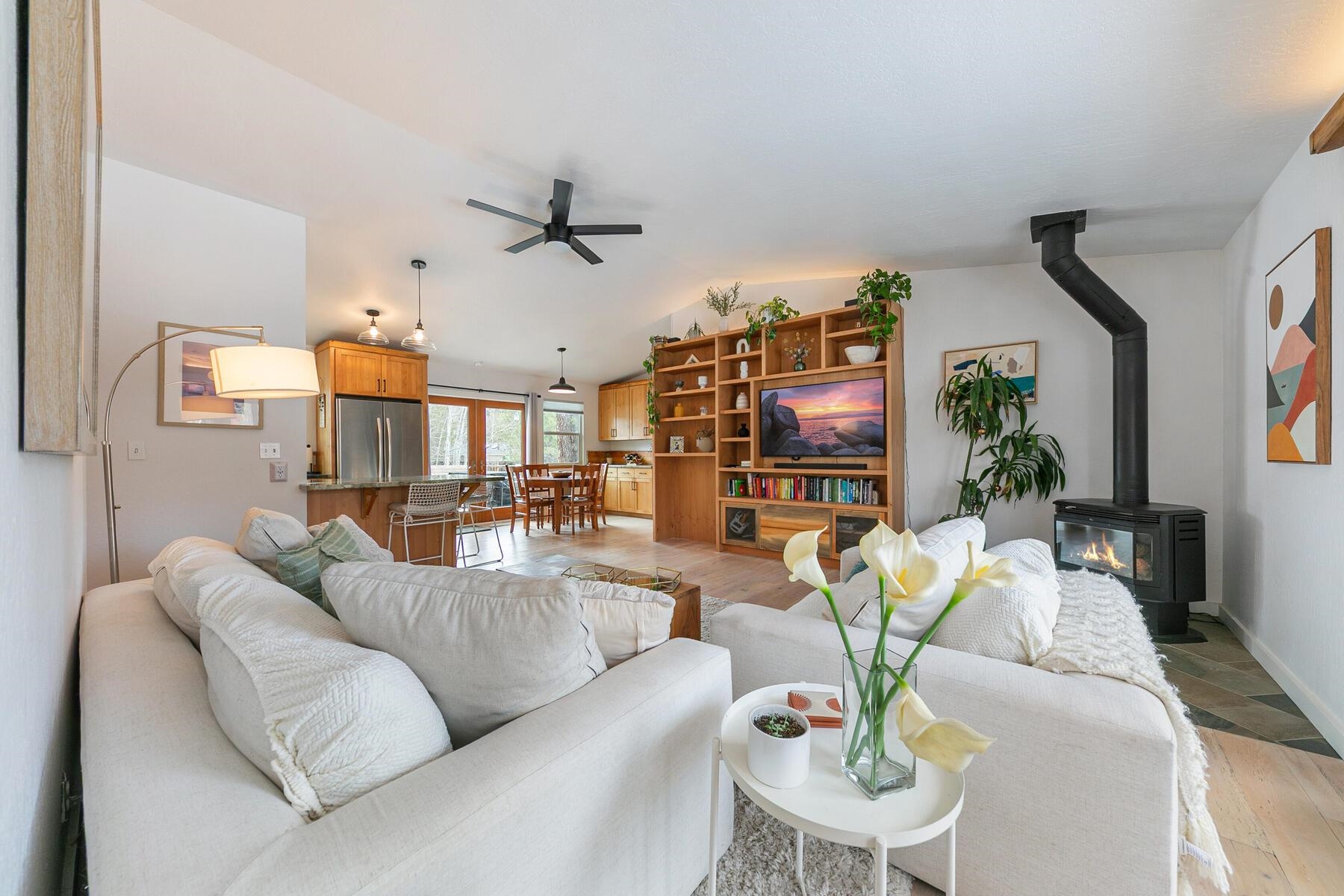 11151 Dorchester Drive Truckee, CA 96161 - Photo 3 of 27 a living room with furniture a ceiling fan and a flat screen tv