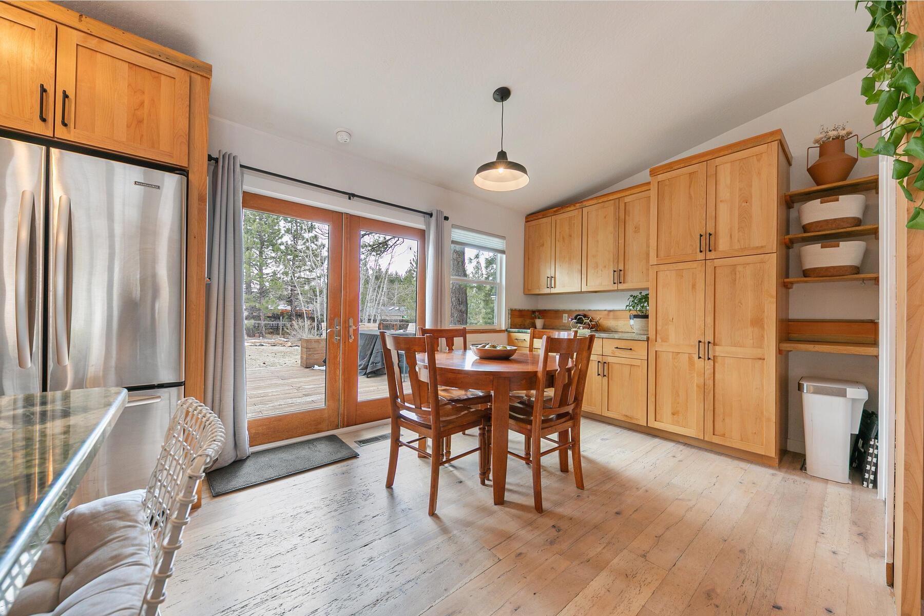 11151 Dorchester Drive Truckee, CA 96161 - Photo 5 of 27 a view of a dining room with furniture window and wooden floor
