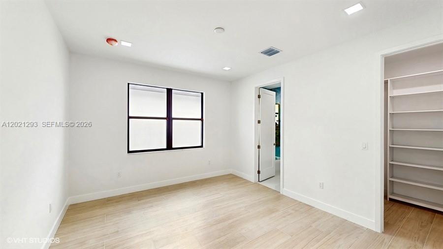 8350 Royal County Down Road Boca Raton, FL 33434 - Photo 31 of 52 an empty room with windows and closet