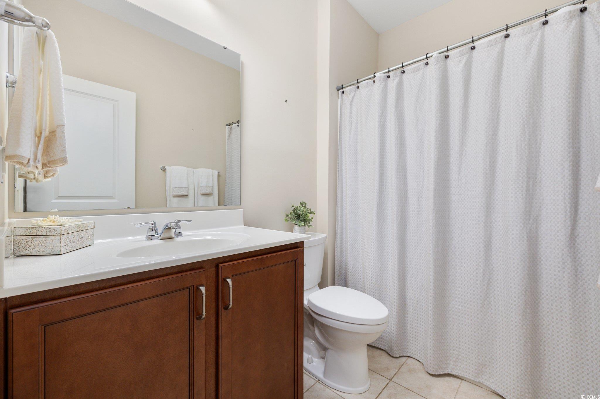 179 Hyacinth Loop Murrells Inlet, SC 29576 - Photo 20 of 40 Full bath featuring vanity, tile patterned flooring, and toilet