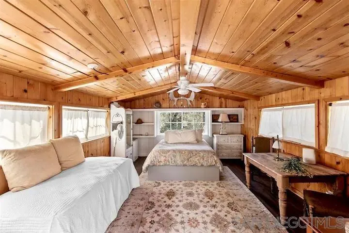 3505 Deer Lake Park Road Julian, CA 92036 - Photo 12 of 46 a bed room with furniture and a chandelier