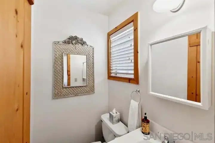 3505 Deer Lake Park Road Julian, CA 92036 - Photo 13 of 46 a bathroom with a toilet sink and mirror