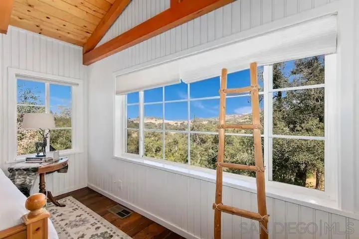 3505 Deer Lake Park Road Julian, CA 92036 - Photo 16 of 46 a bedroom with furniture and a window