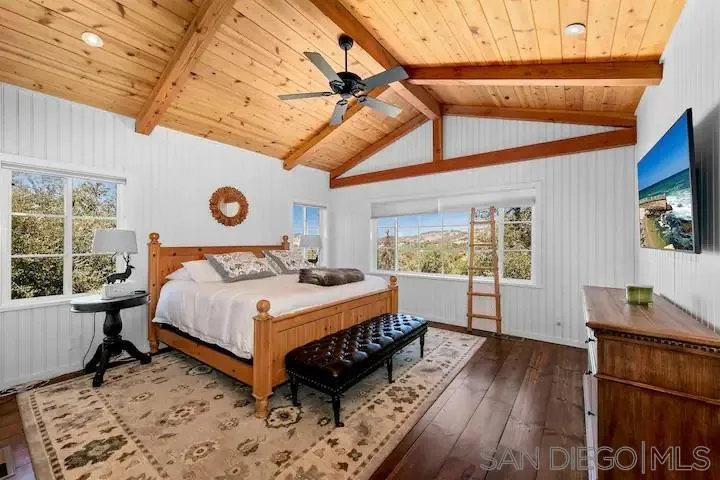 3505 Deer Lake Park Road Julian, CA 92036 - Photo 21 of 46 a bedroom with a bed and wooden floor
