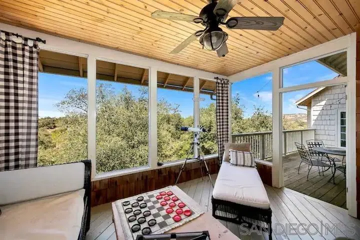 3505 Deer Lake Park Road Julian, CA 92036 - Photo 34 of 46 a balcony view with a potted plant and outdoor seating