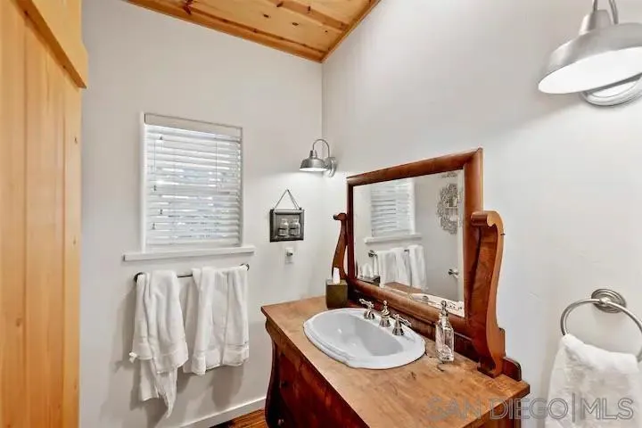 3505 Deer Lake Park Road Julian, CA 92036 - Photo 36 of 46 a bathroom with sinks a mirror and a sink