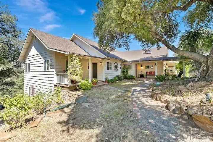 3505 Deer Lake Park Road Julian, CA 92036 - Photo 40 of 46 a view of a house with a small yard and large tree