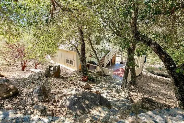 3505 Deer Lake Park Road Julian, CA 92036 - Photo 44 of 46 a white house that has a tree in front of it