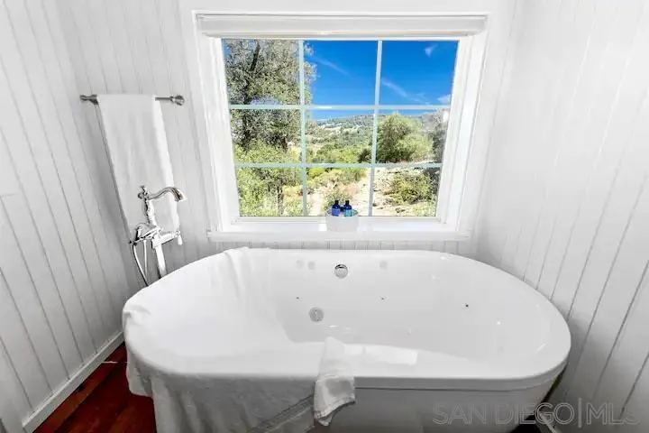 3505 Deer Lake Park Road Julian, CA 92036 - Photo 6 of 46 a white bath tub sitting in a bathroom