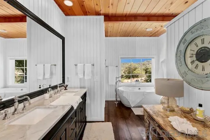 3505 Deer Lake Park Road Julian, CA 92036 - Photo 10 of 46 a bathroom with a sink a mirror and a bathtub