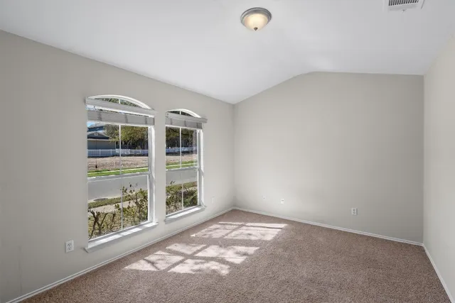 a bathroom with a tub a sink and mirror