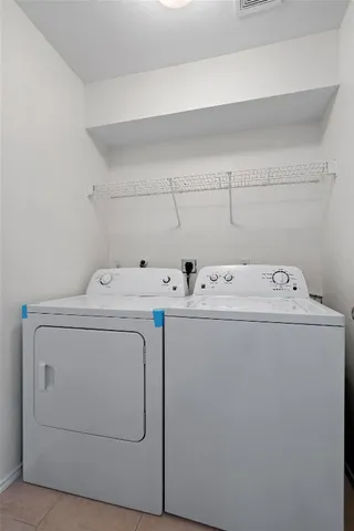 a view of a house with a wooden deck and a yard