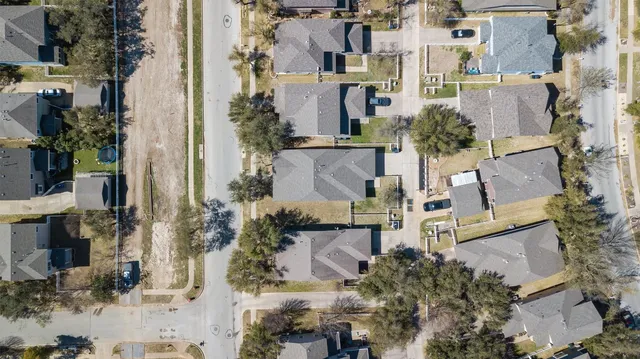 an aerial view of residential building and parking space