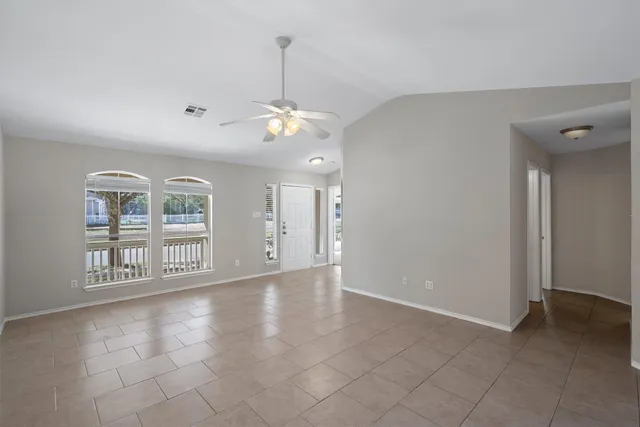a view of an empty room with a window
