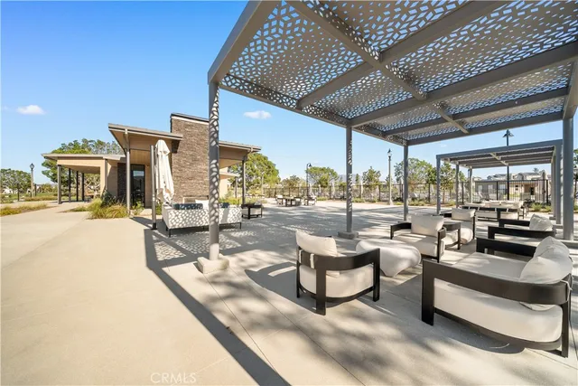 a view of a patio with a table chairs and a patio