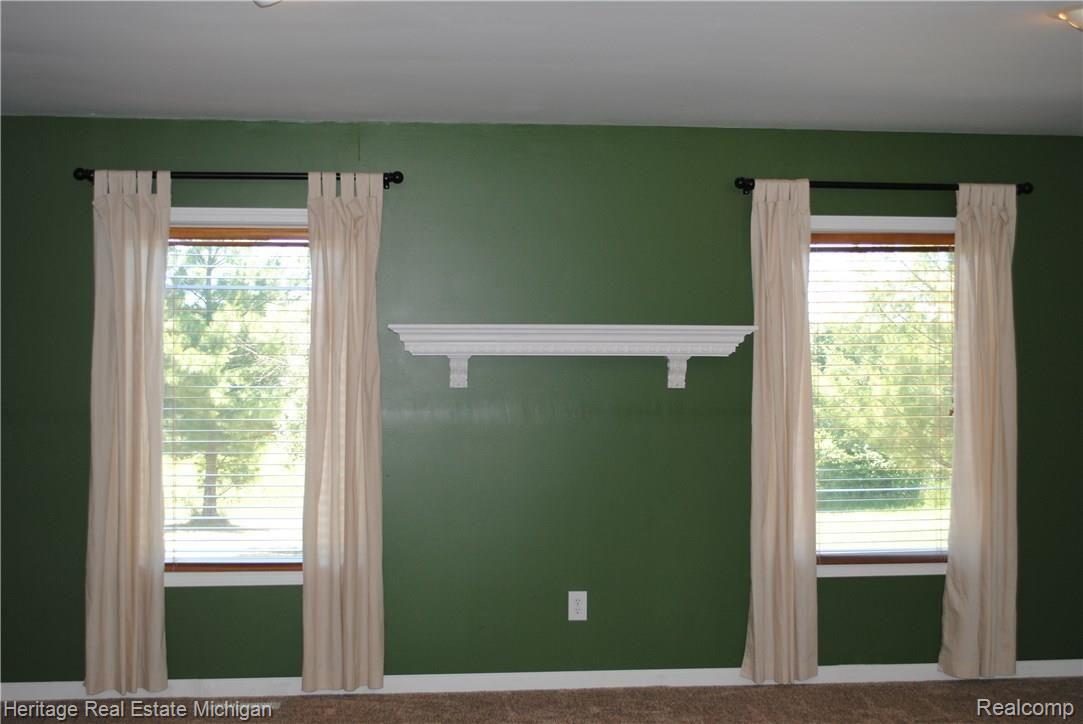 4354 Crandall Road Howell, MI 48855 - Photo 2 of 17 Spacious, sunlit great room (21' x 21") with windows that offer great views of the countryside!
