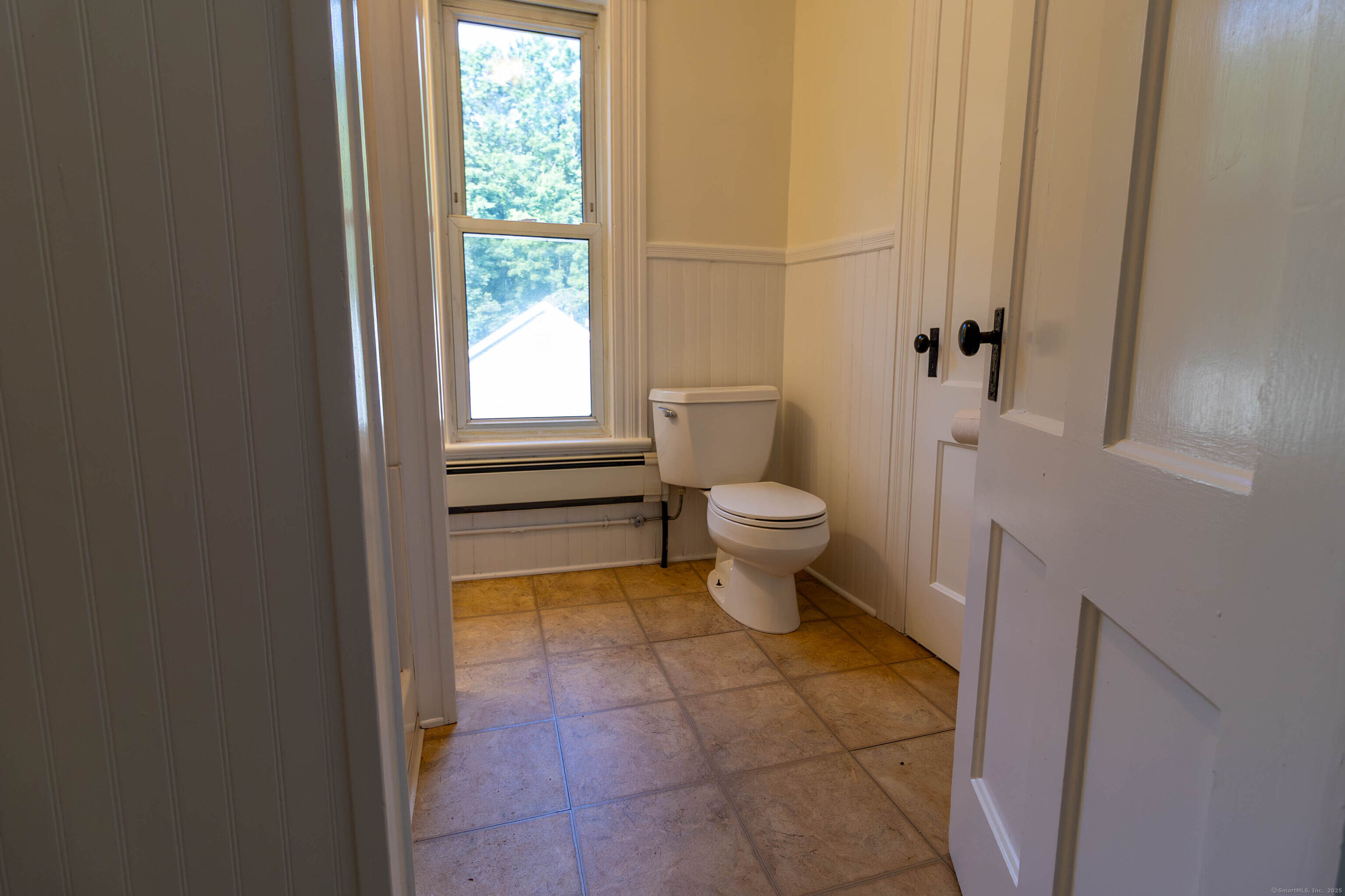 62 Lincoln Avenue Torrington, CT 06790 - Photo 4 of 15 a bathroom with a toilet a sink and a window