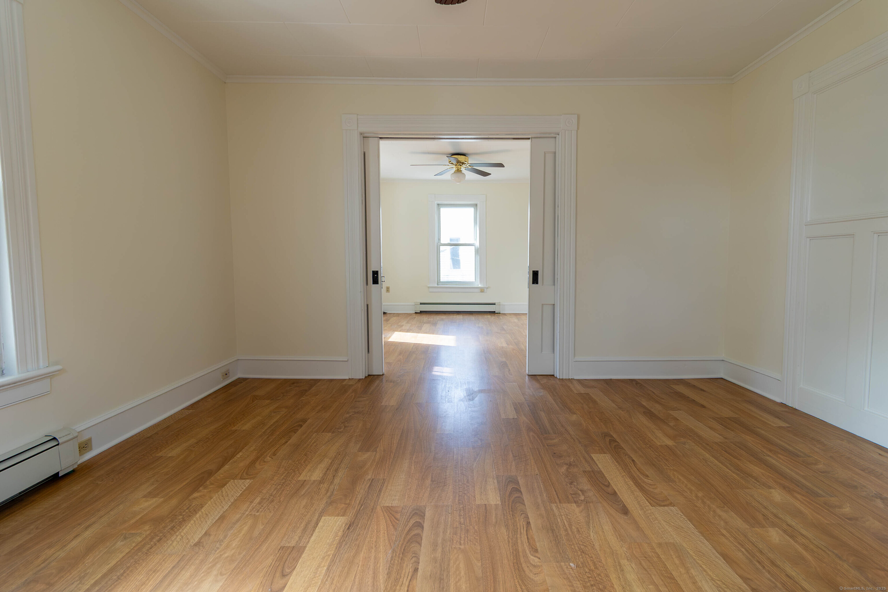 62 Lincoln Avenue Torrington, CT 06790 - Photo 10 of 15 a view of a small space with wooden floor and a window