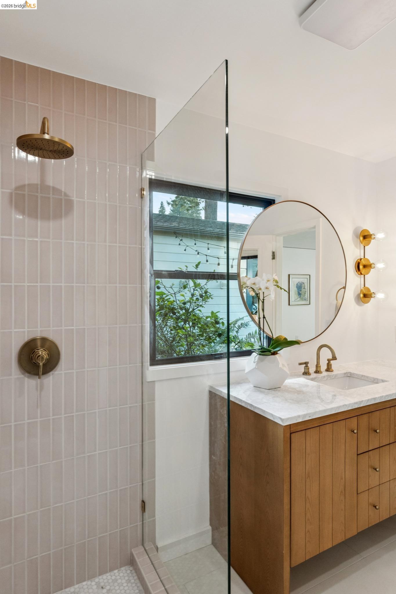 38 Highgate Road Kensington, CA 94707 - Photo 26 of 78 Glass-enclosed shower with vertical tile surround and brass fixtures