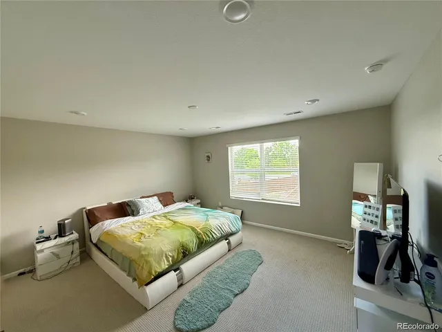 a bathroom with a double vanity sink mirror and shower