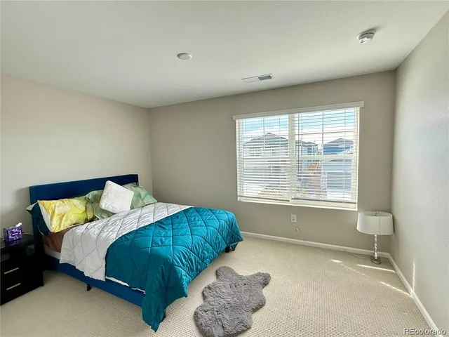 a view of walk in closet with clothes