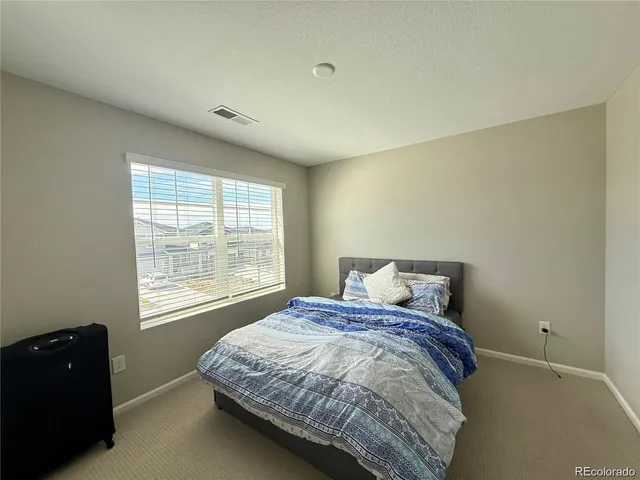 a bathroom with a sink a toilet a shower and a mirror