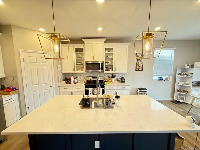 a bed room with furniture and a chandelier