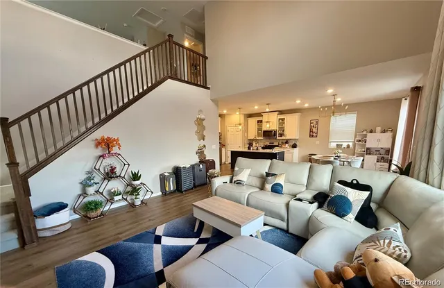 a living room with furniture fireplace and a flat screen tv