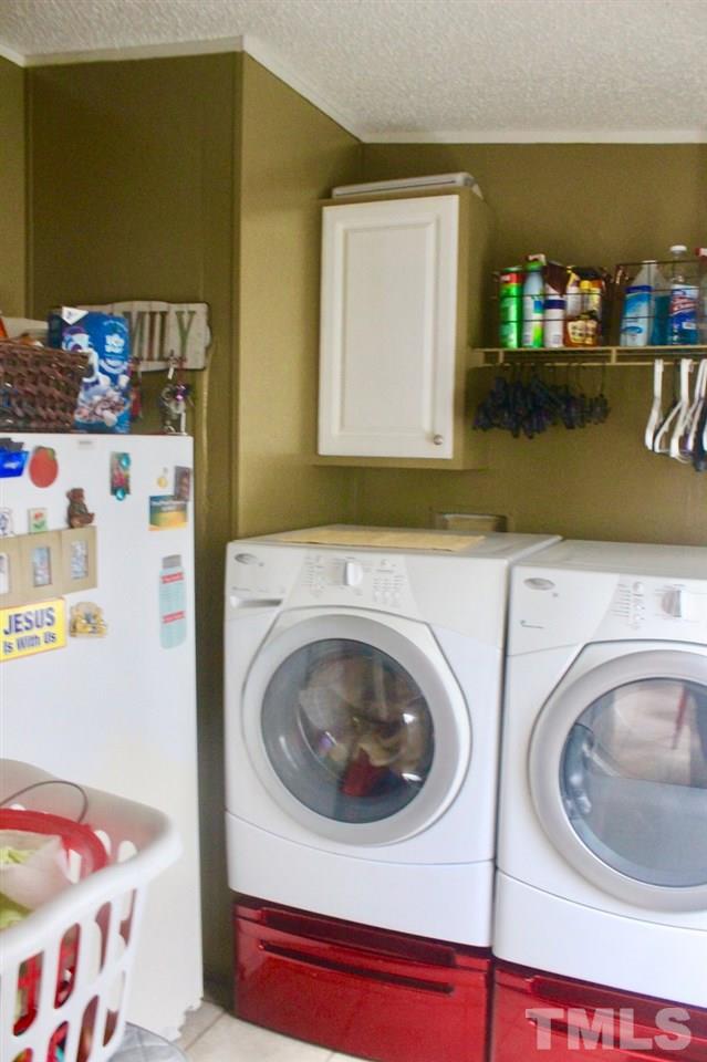 73 Inscoe Road Castalia, NC 27816 - Photo 14 of 18 Come in from the back deck and throw your wet clothes right in the washer and dryer to alleviate the messy floors! Built in shelving and this is where your security system is located as well.