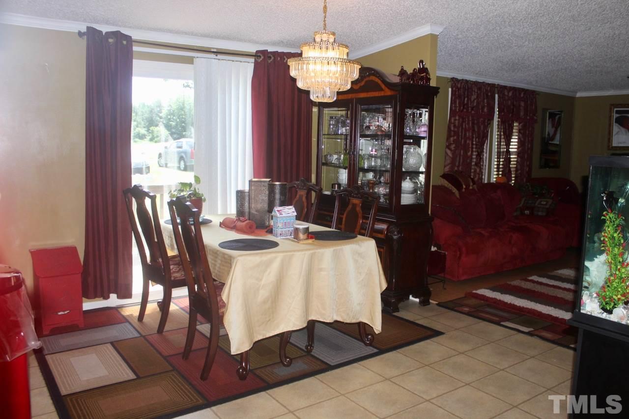 73 Inscoe Road Castalia, NC 27816 - Photo 8 of 18 Large breakfast room for additional seating. Gather all of your friends and family over for the holidays and enjoy a meal together!