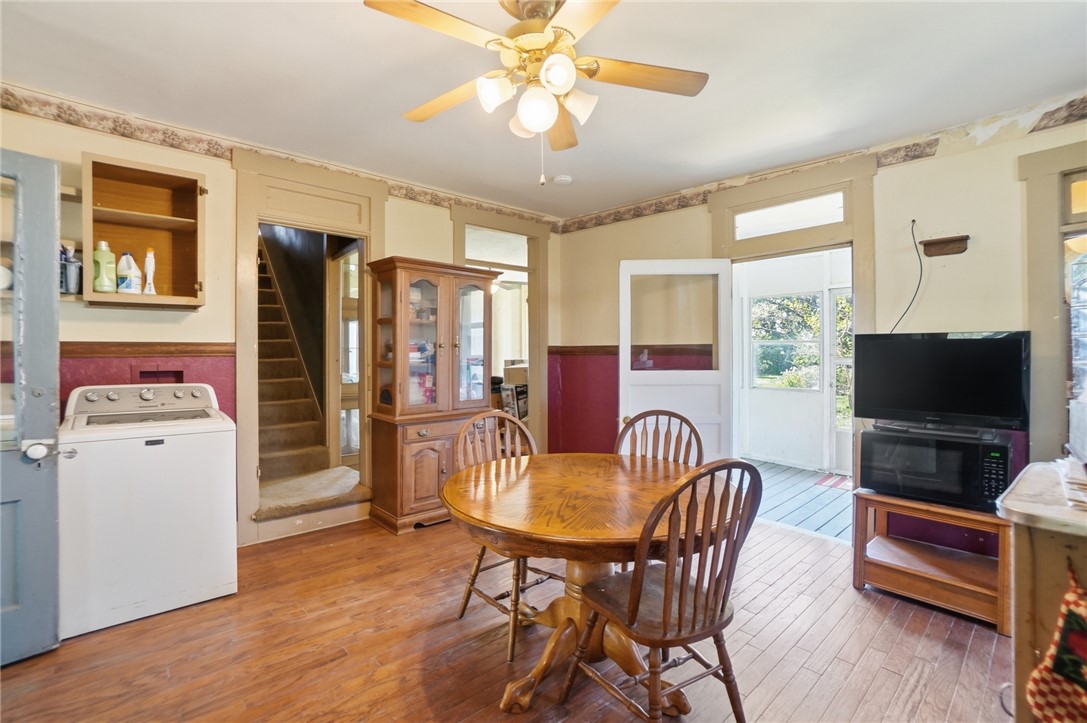 1444 Eagle City Road Springfield, OH 45504 - Photo 23 of 50 This inviting space features classic hardwood floors, a comfortable dining area, and easy access to outdoor living.