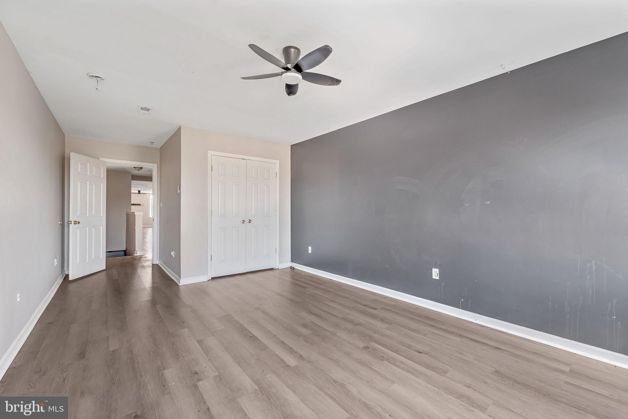 139 State Street Camden, NJ 08102 - Photo 12 of 29 a view of an empty room with wooden floor and a ceiling fan