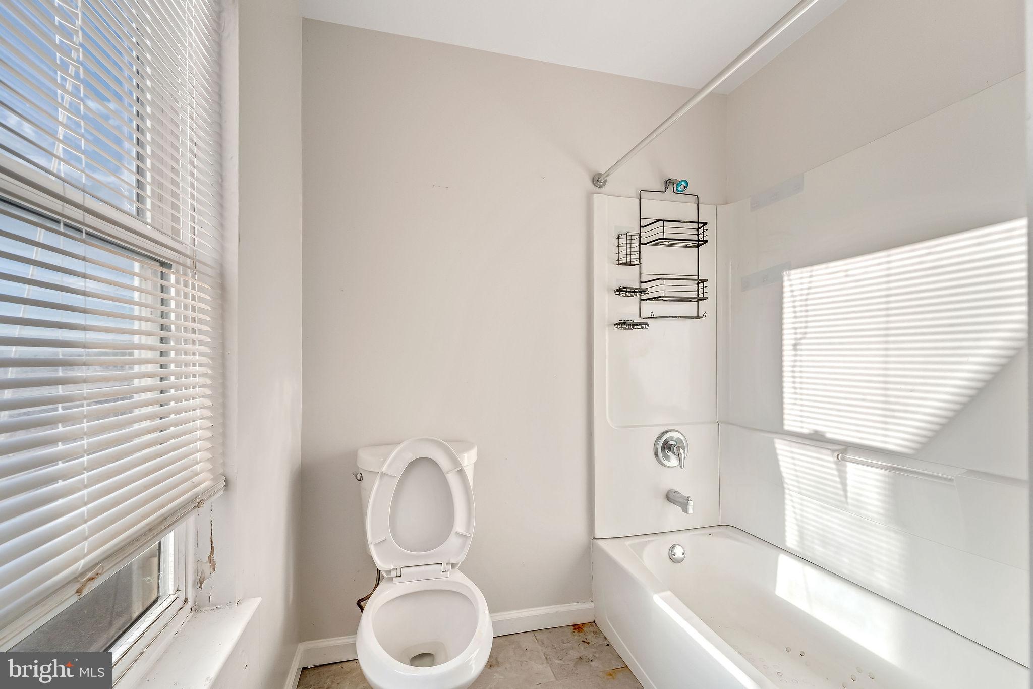 139 State Street Camden, NJ 08102 - Photo 15 of 29 a bathroom with a toilet and a bathtub