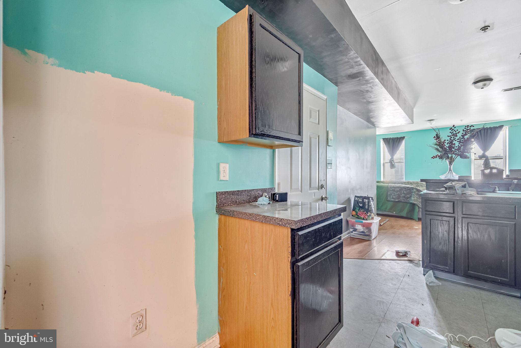 139 State Street Camden, NJ 08102 - Photo 24 of 29 a kitchen with a sink cabinets and wooden floor