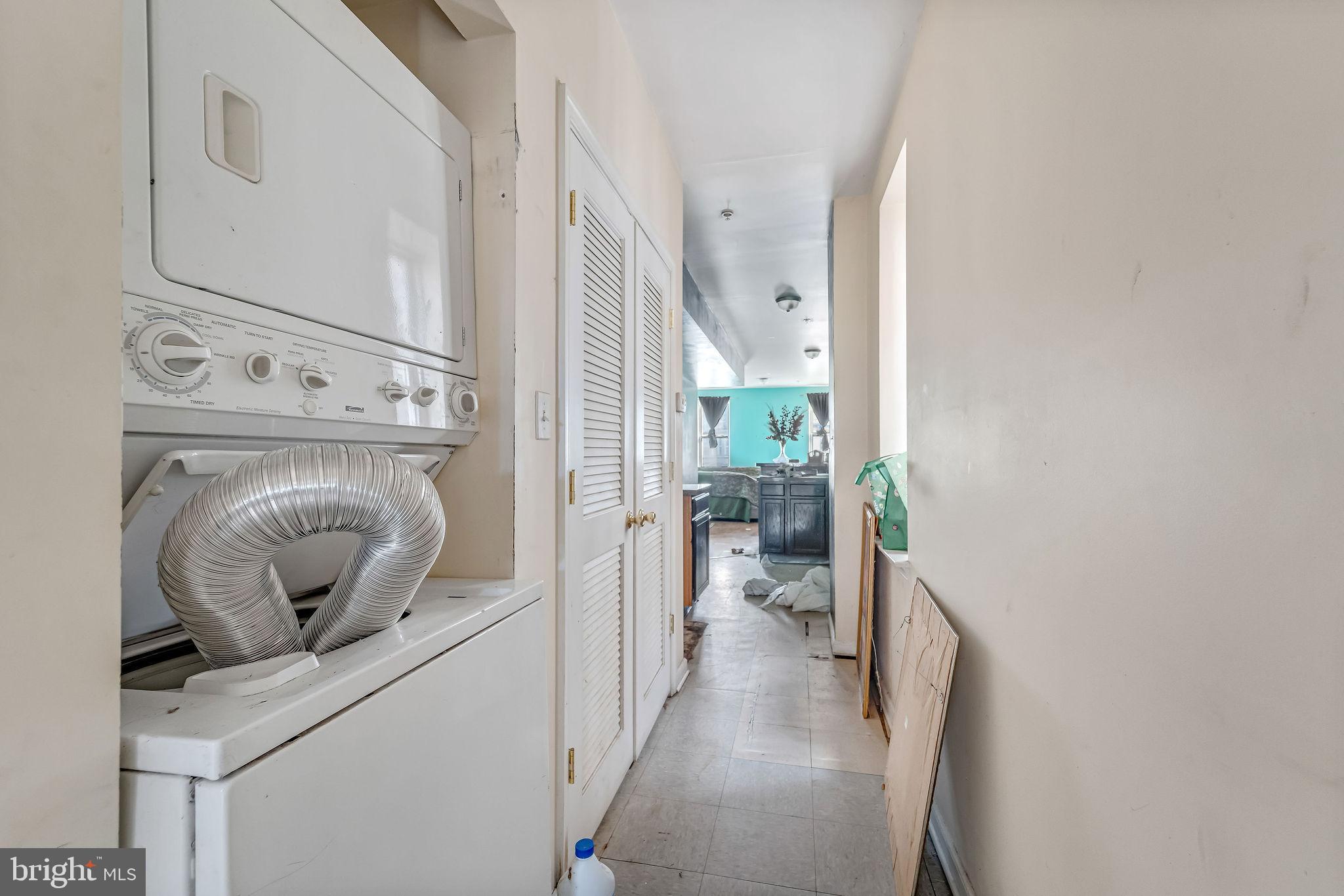 139 State Street Camden, NJ 08102 - Photo 25 of 29 a view of a hallway with a washer and dryer